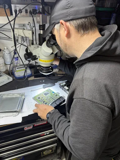 Close inspection of an automotive control module circuit board